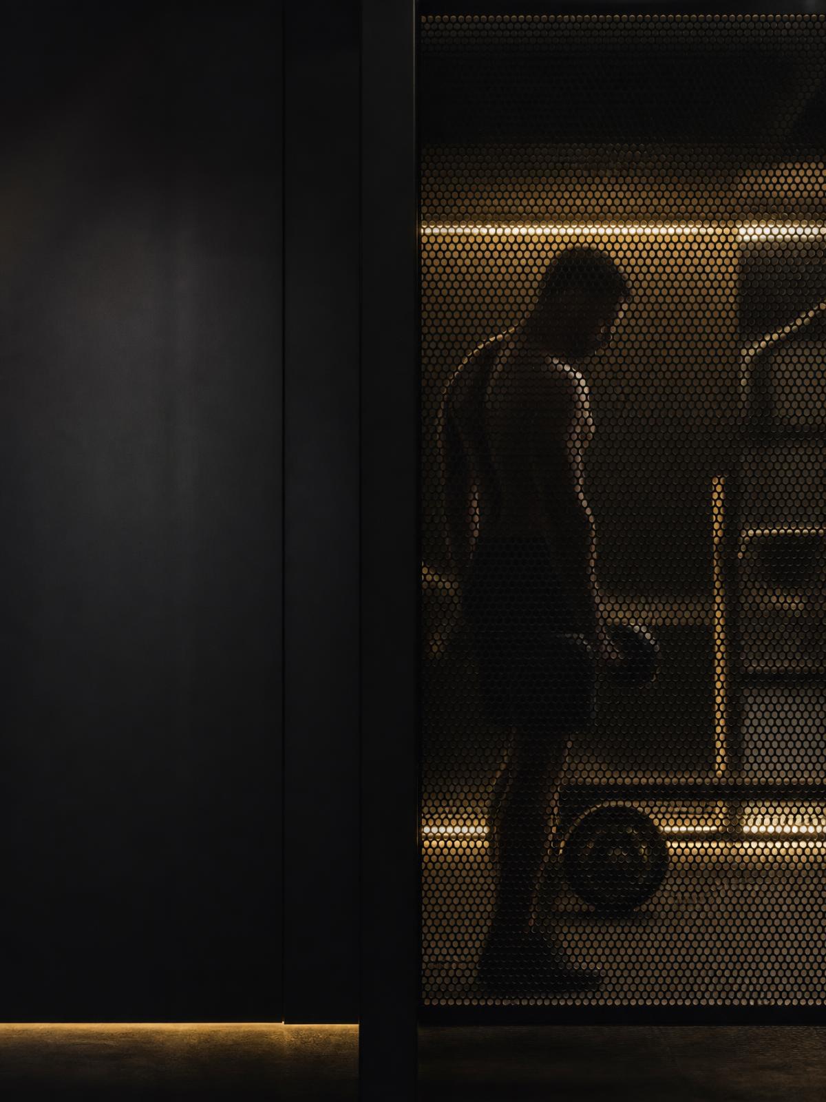 Training space seen through an architectural metal screen